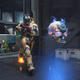 A spartan approaches the oddball, while another player sprints behind them.
